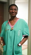 Portrait of a smiling nurse in clinical scrubs